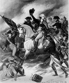 An illustration of Gen. George Washington on a horse holding his hat as he leads his men in a battle in 1777